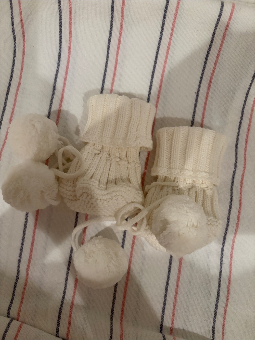 Petite + Co pom pom booties newborn milk